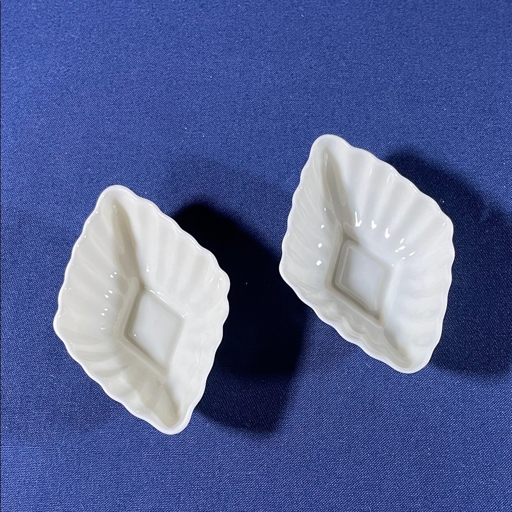 Two diamond shaped Belleek salt cellars.